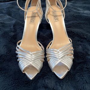 Beautiful strappy silver heel with pointed toe.